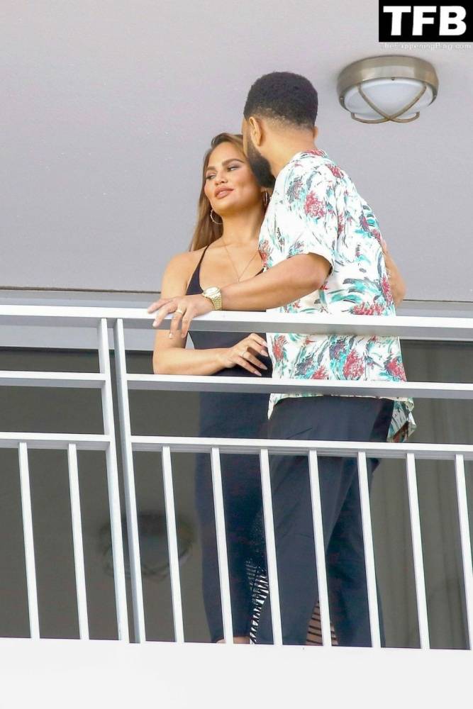 Chrissy Teigen & John Legend Kiss and Pose During an Impromptu Balcony Shoot - #19