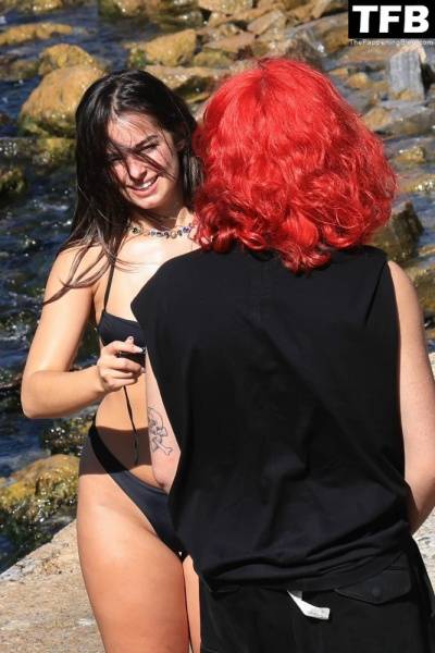 Addison Rae Displays Her Curves in a Black Bikini on Holiday with Omer Fedi on Lake Como on modelfansclub.com