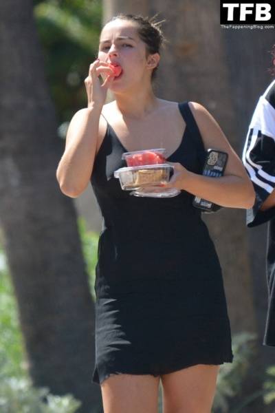 Addison Rae Indulges in Some Refreshing Watermelon While Out in a Tight Skirt with Her Boyfriend on modelfansclub.com